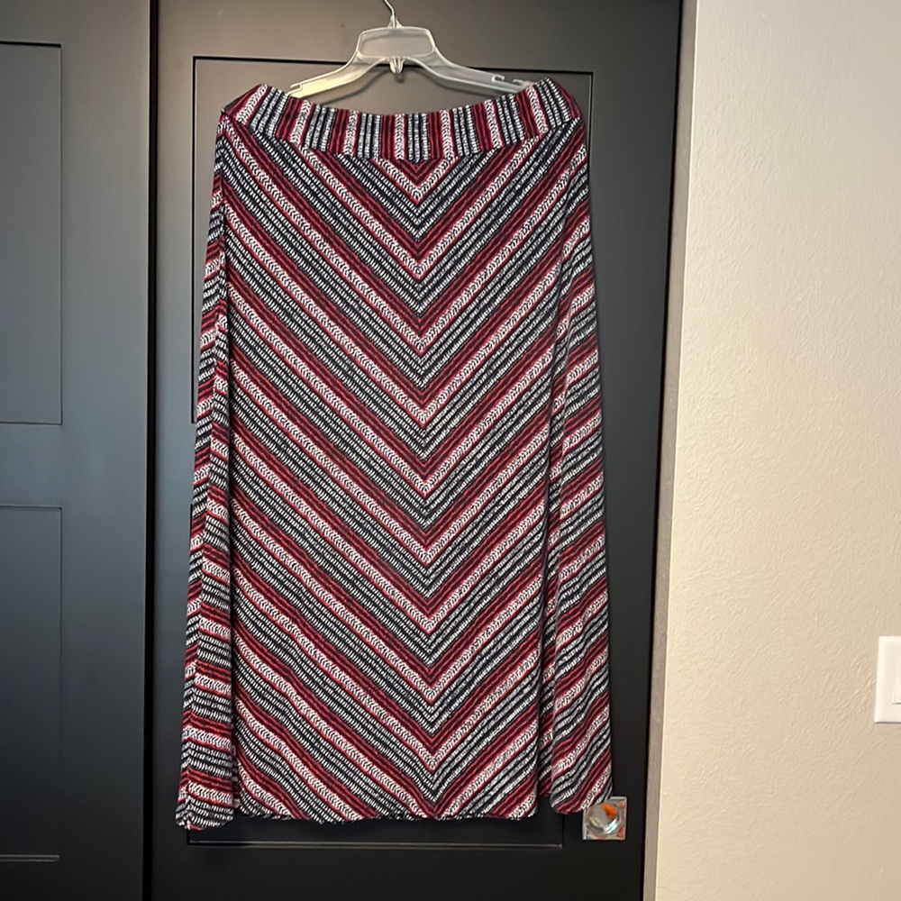 Red, a white and blue maxi skirt by Westport. Very infrequently worn.